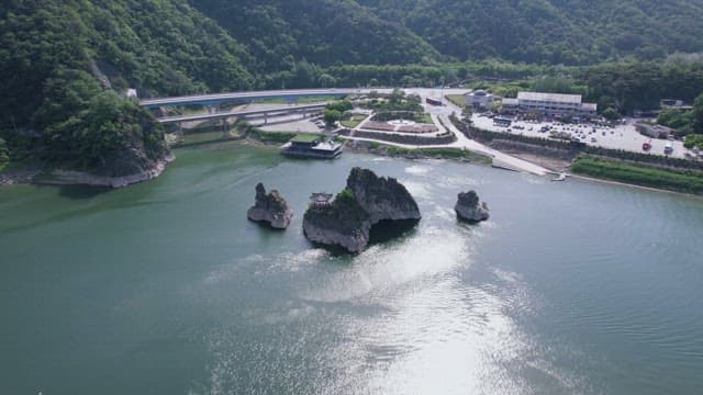 Scenic View of River with Rocks and Bridge of Danyang