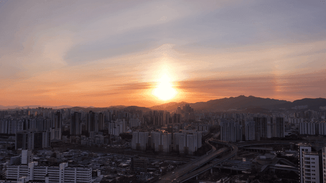 Sunset over a sprawling cityscape