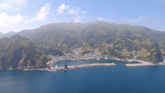 Coastal town surrounded by mountains