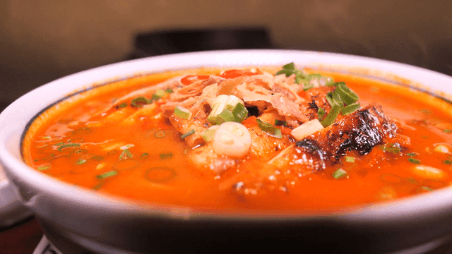 Chicken rice noodles in spicy broth