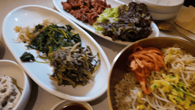 Various Korean side dishes and bibimbap