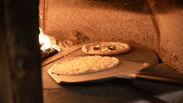 Pizza dough placed in oven