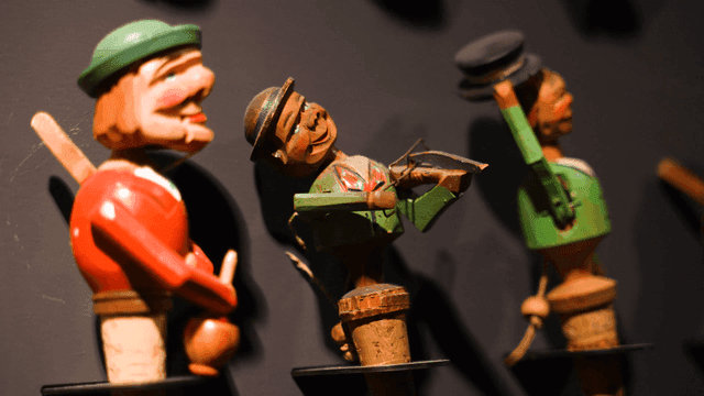 Cork tree dolls displayed on shelf