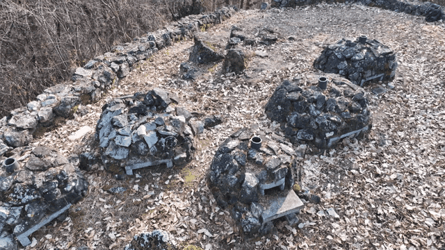 Pile of stones in clearing in forest