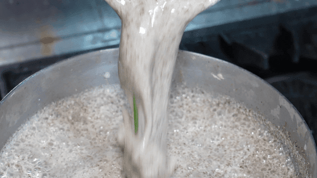 Perilla leaf handmade dumplings poured into pot
