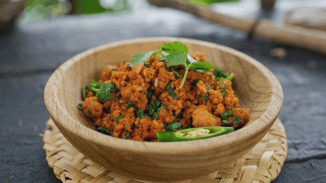 Bowl of spicy bulgur salad with herbs