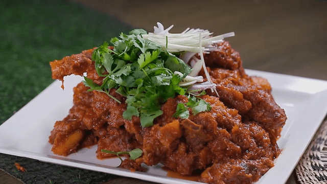 Spicy Braised Pork Galbi garnished with cilantro