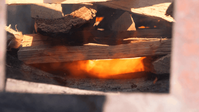 Burning wood with visible flames