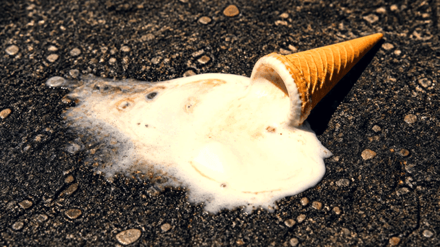 Melted ice cream on asphalt