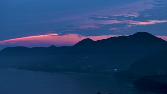 Twilight over Tranquil Mountains and Sea