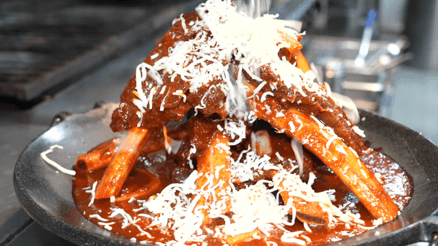 Spicy braised short ribs topped with cheese