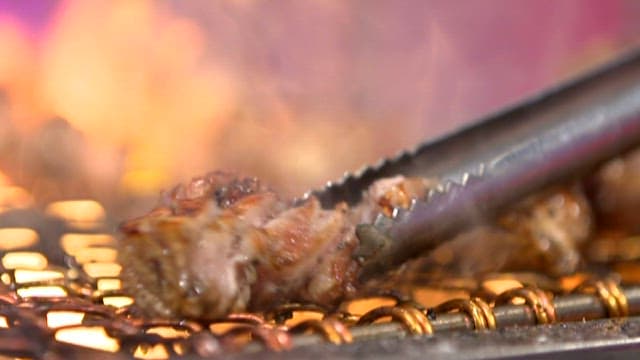 Sizzling Meat on a Hot Grill