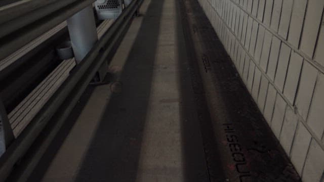 Vehicles moving through a curved tunnel