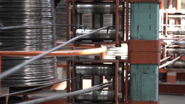 Metal wire being processed in a factory