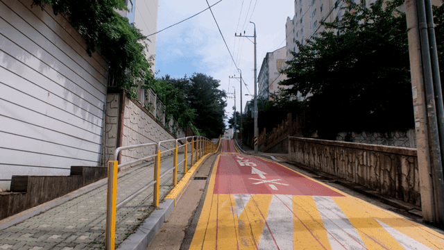 Quiet, narrow road with steep slope