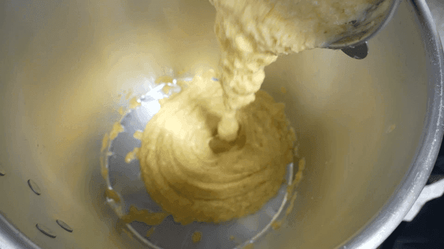 Ground fruit poured into large pot