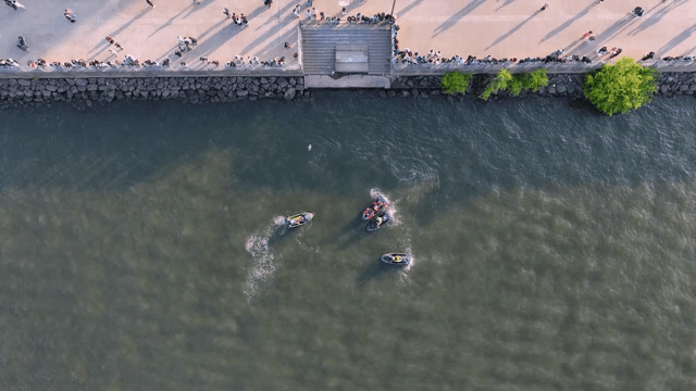 Enjoying jet skiing on the riverside with people