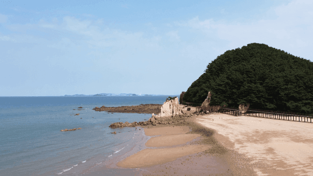 Quiet beach with rocky coastline