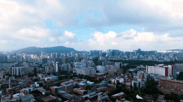 Sprawling cityscape under a blue sky