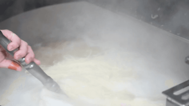 Noodles being cooked in boiling water