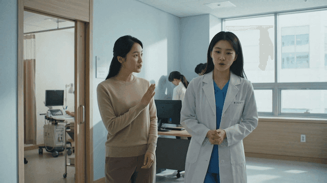 Doctor and patient having a conversation in a hospital room