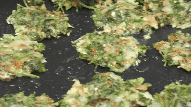 Cilantro pancakes cooked in pan