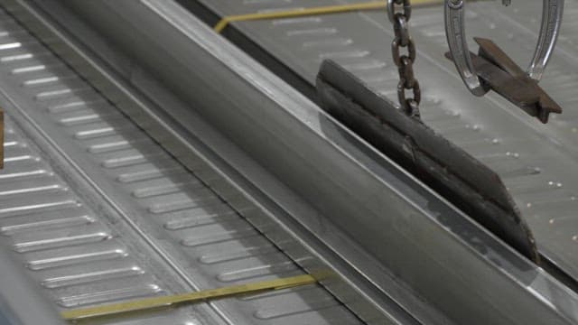 Metal parts being processed in a factory