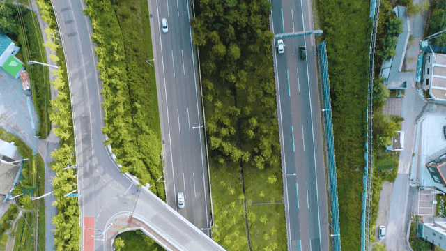 Aerial view of a highway surrounded by greenery