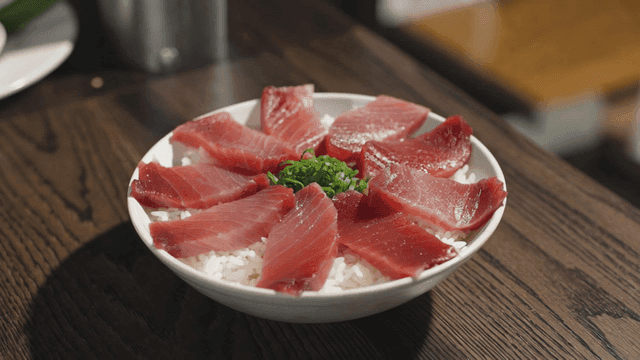 Sashimi rice bowl topped with tuna sashimi