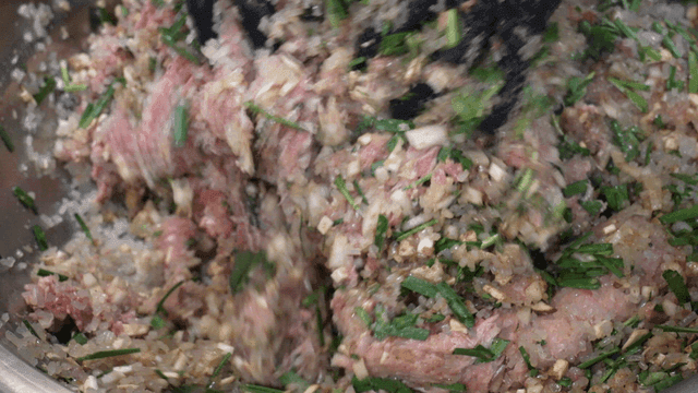 Dumpling filling mixed in large basin