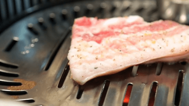 Grilling Pork Belly on a barbecue grill