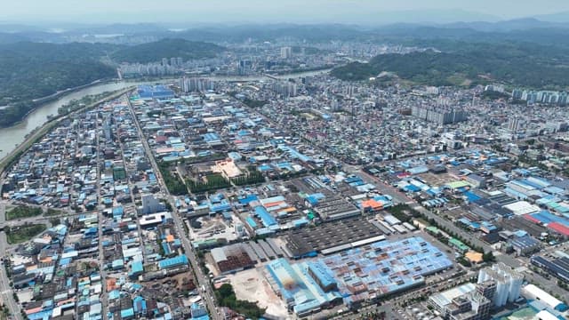 Expansive cityscape with industrial areas