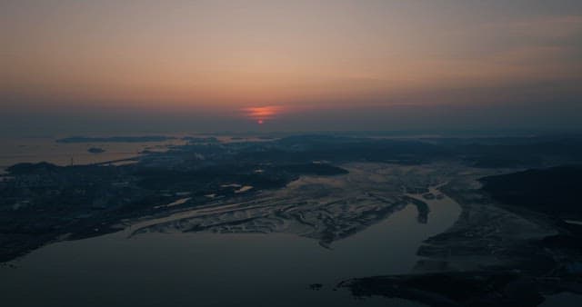 Sunset Over a Tranquil Coastal Landscape