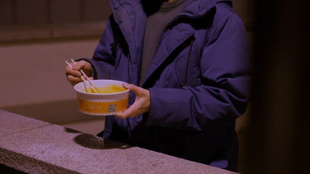 Individual Eating Ramen as a Dinner Meal