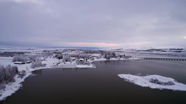 Snow-covered landscape with a serene lake