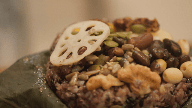 Lotus leaf wrapped rice with nuts and seeds