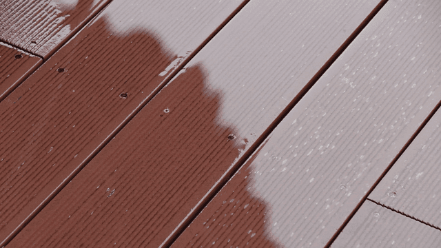 Raindrops falling on wooden deck