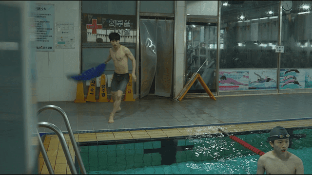 Man diving into swimming pool in hurry
