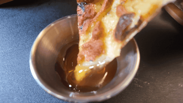 Pizza slices dipped in honey