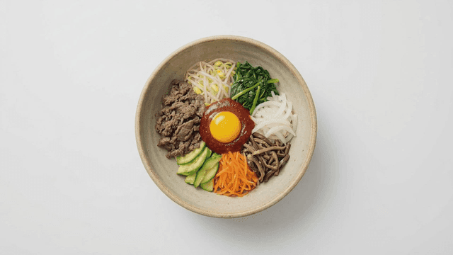 A bowl of bibimbap with colorful ingredients