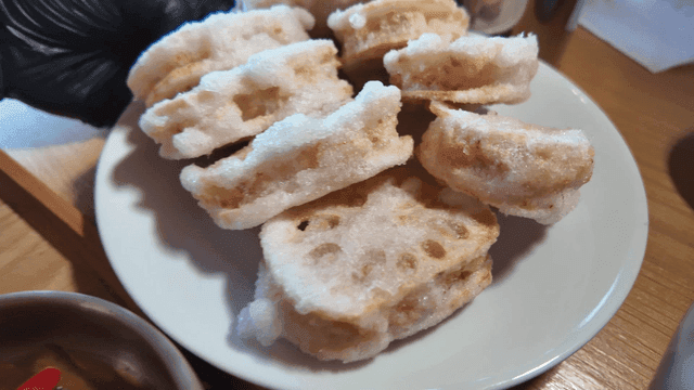 Lotus root fritters on a white plate