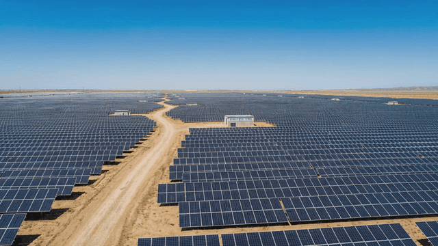 vast solar panel field under clear sky