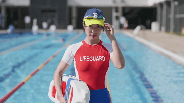 Lifeguard standing by the poolside