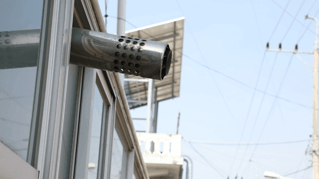 Metal exhaust pipe on a building