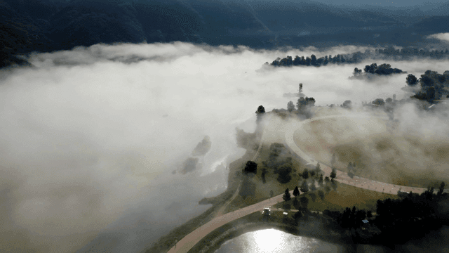 Mountain and foggy river scenery