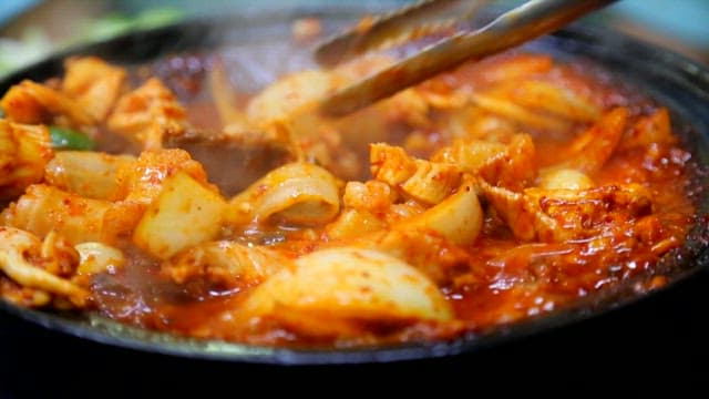 Grilled marinated beef tripe with vegetables and mushrooms