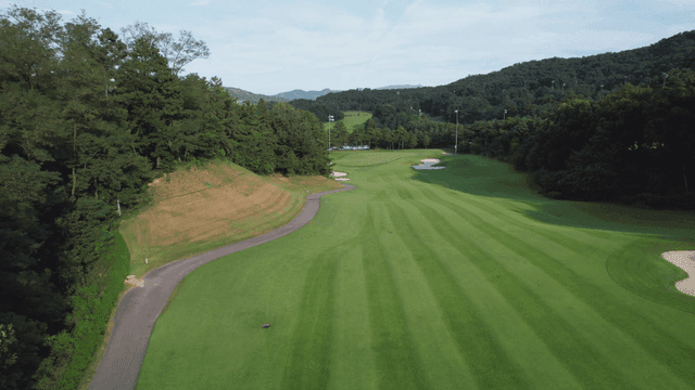 Scenic golf course surrounded by trees