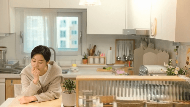 Woman anxious in kitchen
