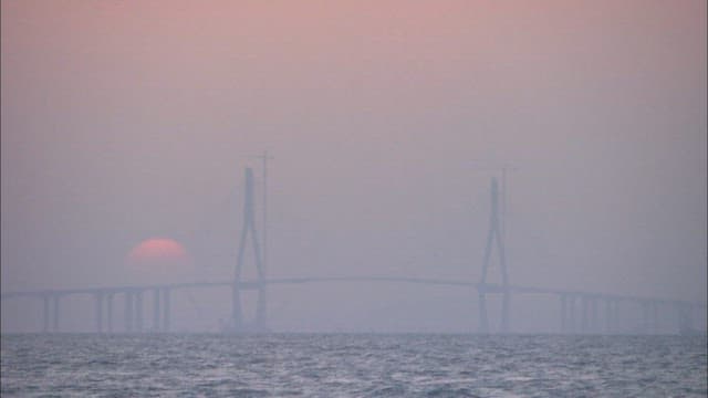 Sunset Behind a Silhouetted Incheon Bridge