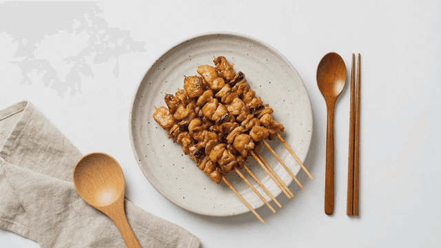 Grilled chicken skewers on a plate